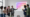 Une équipe de professionnels du marketing digital célèbre le succès d'une stratégie Instagram devant un écran affichant le logo des 15 ans de la plateforme.